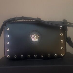 Brand New Versace eyelets Medusa head calf leather black shoulder bag.